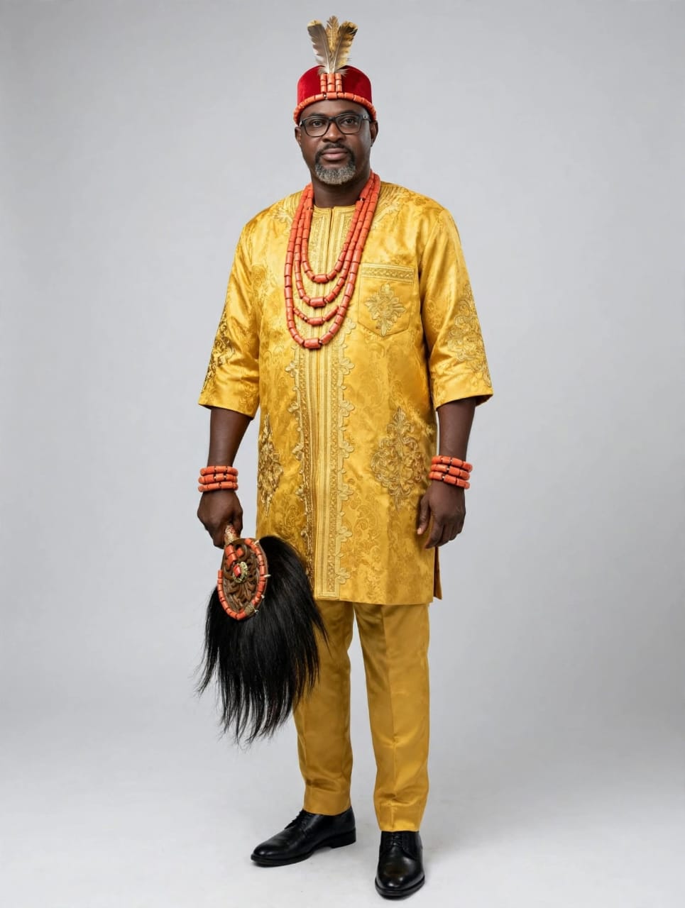 Gold Brocade Attire with Traditional Horsetail Fan